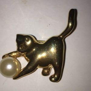 Goldtone Kitten Playing with a Pearl